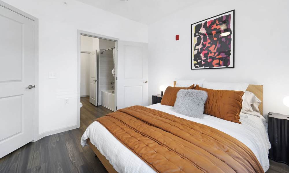 Bedroom with attached bathroom at The Warrick in Nashville, Tennessee