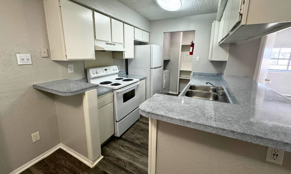 Kitchen with modern appliances at Santa Fe Apartments in Dallas, Texas