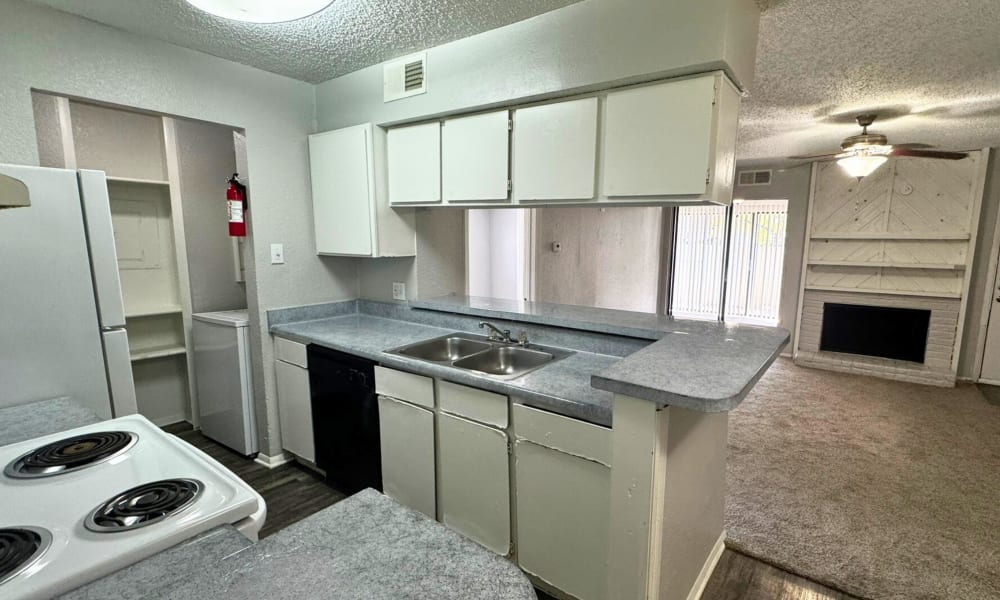 Kitchen with a sink at Santa Fe Apartments in Dallas, Texas