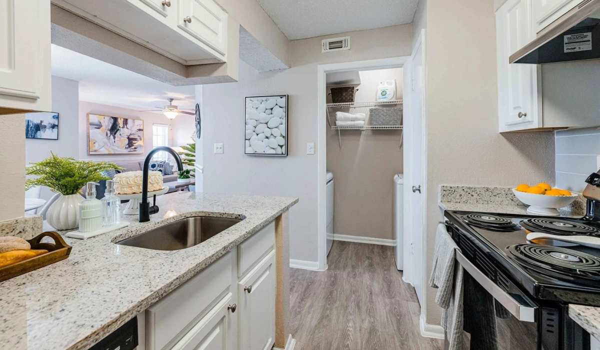 Modern kitchen with black appliances at The Park at Via Veneto in Jacksonville,Florida