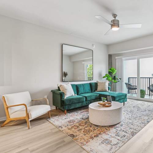 Living room with ceiling fan at The Breeze in Winter Haven, Florida