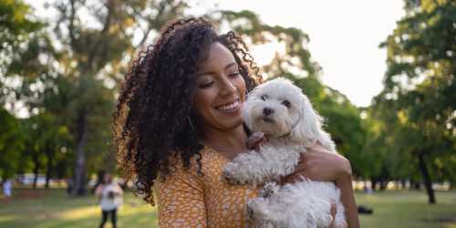Resident with her pet at Creekwood Townhomes in Hammond, Louisiana