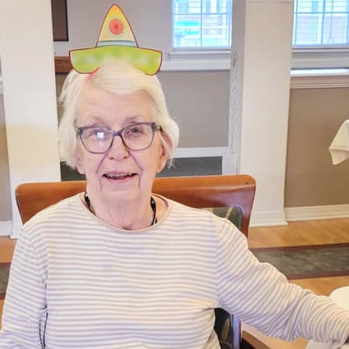 A resident with a fun hat at Homestead House in Beatrice, Nebraska
