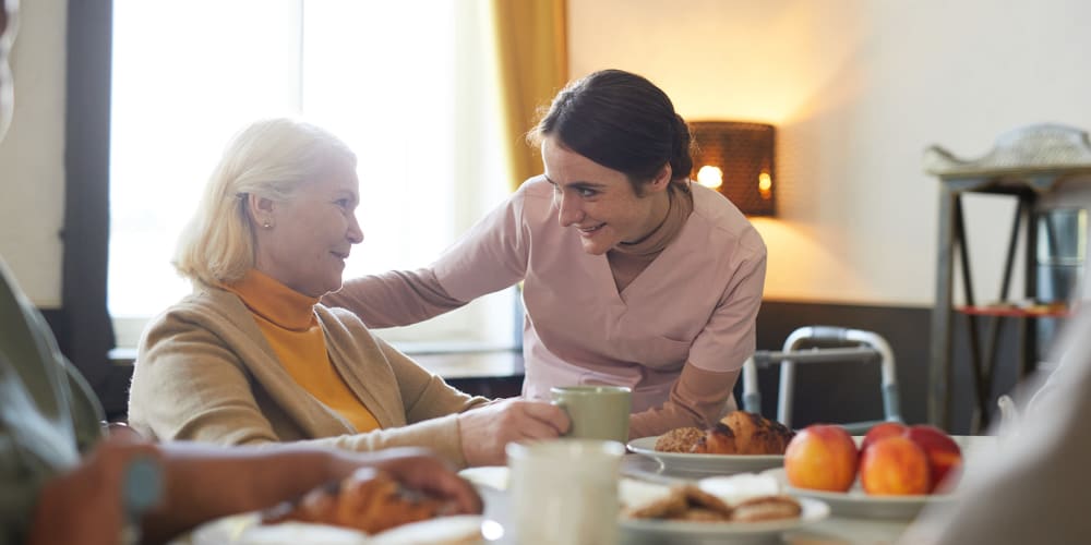 Resident looking at his tablet at at Vista Prairie Communities in Champlin, Minnesota