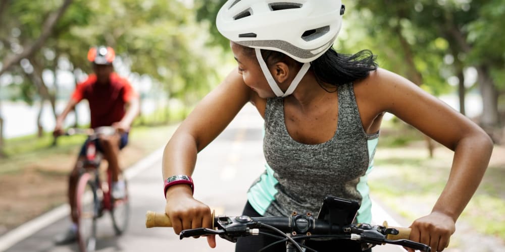 Two people riding bikes near Villas at Princeton Lakes in Atlanta, Georgia