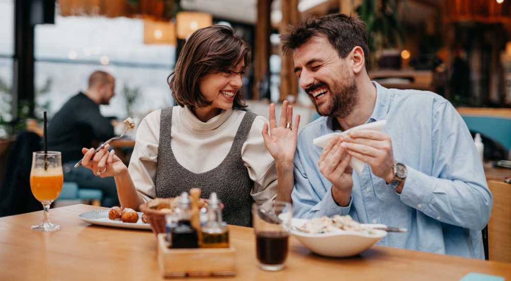 Friends enjoying food at a restaurant near Lankershim Arms in North Hollywood, California 