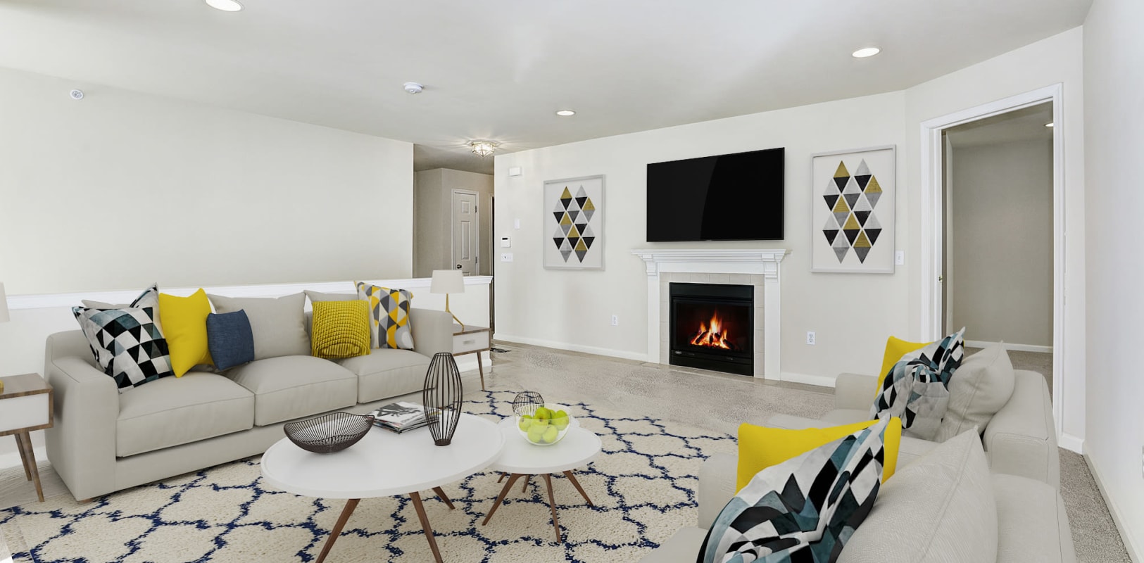 New plush carpeting and a fireplace in a model home's living area at Hanover Glen in Bethlehem, Pennsylvania