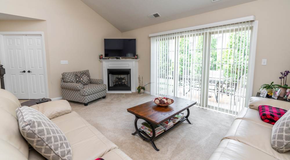 Model home with a fireplace at Summit Ridge in Oakdale, Pennsylvania