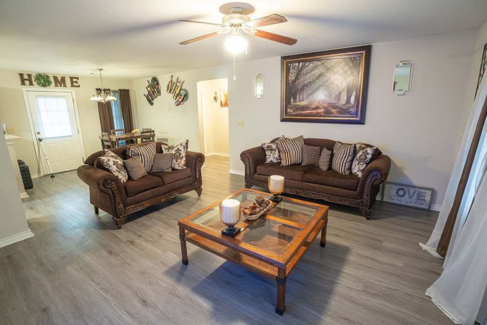 Living room with couch and coffee table at Bolivar Homes in Cleveland,Mississippi