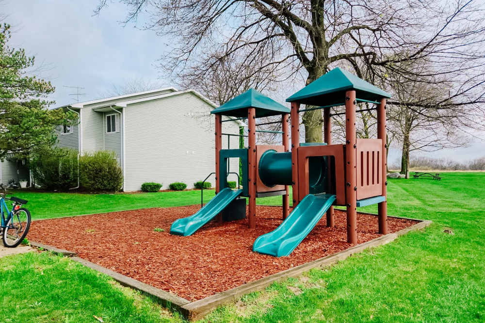 Play area for kids at Rivercrest Apartments in Croswell, Michigan