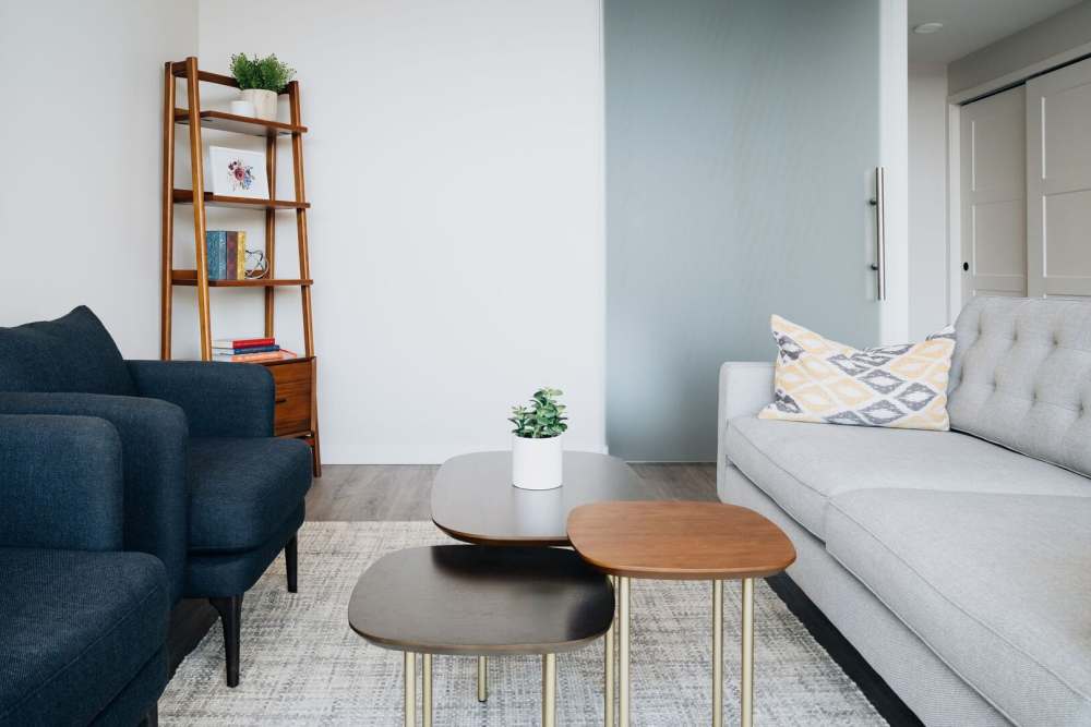 Rendering of living room and coffee table at Studio Park Lofts & Tower in Grand Rapids, Michigan