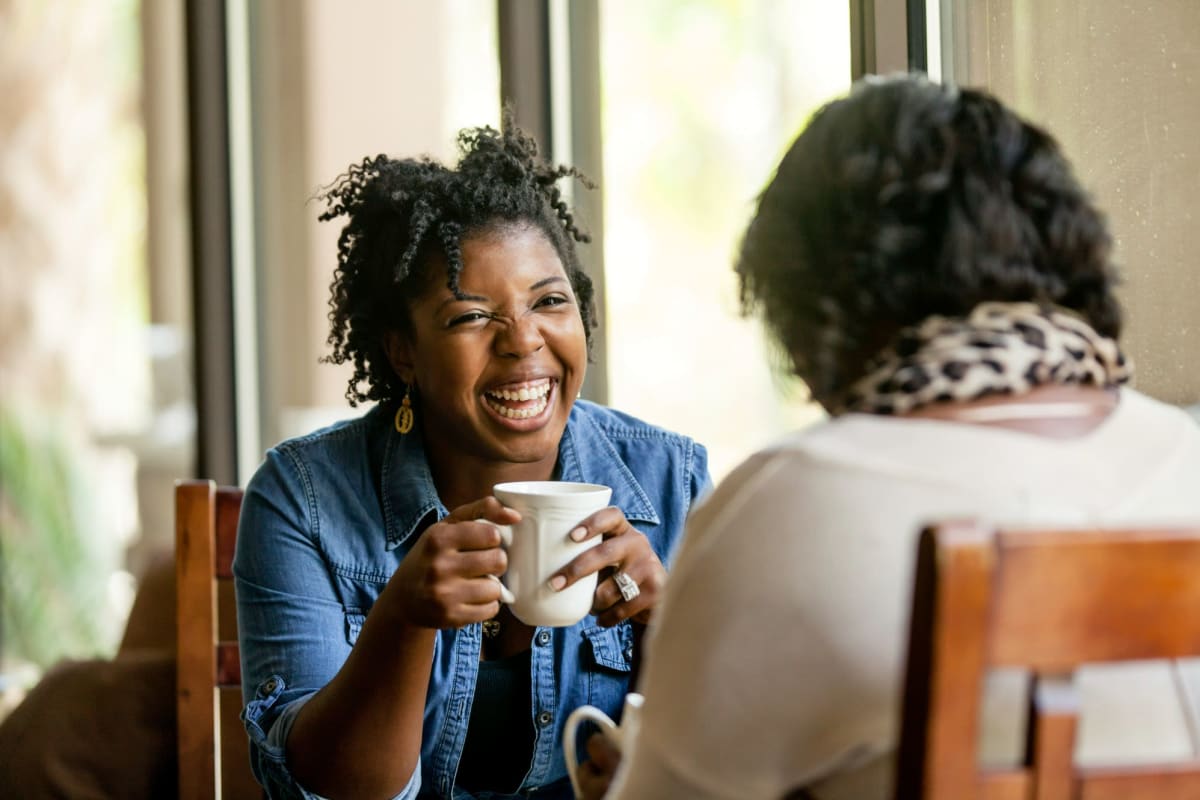 Residents enjoy coffee on their private patio at Playa Pacifica, Playa Del Rey, California