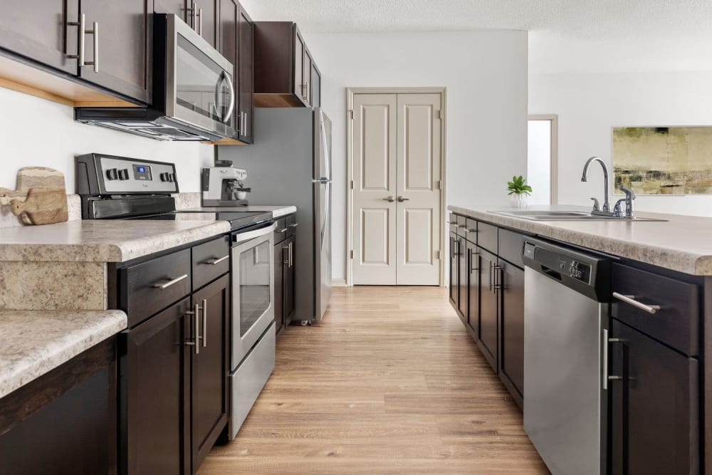 Model kitchen with table island at Lakeline at Bartram Park in Jacksonville, Florida