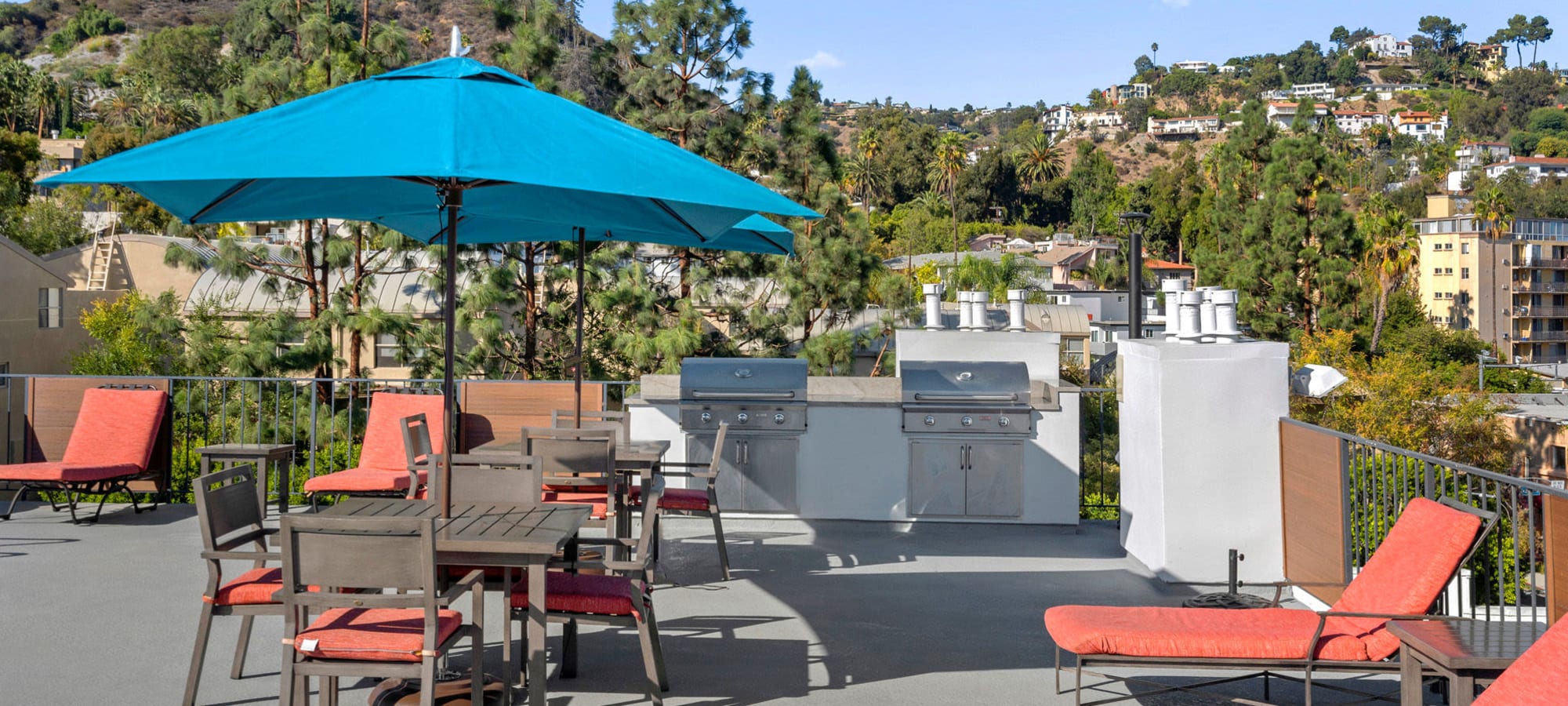 Outdoor table with umbrella at The Ruby Hollywood, Los Angeles, California