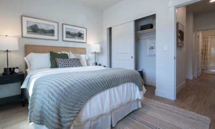 Cozy bedroom at The Heights at Happy Valley in Happy Valley, Oregon