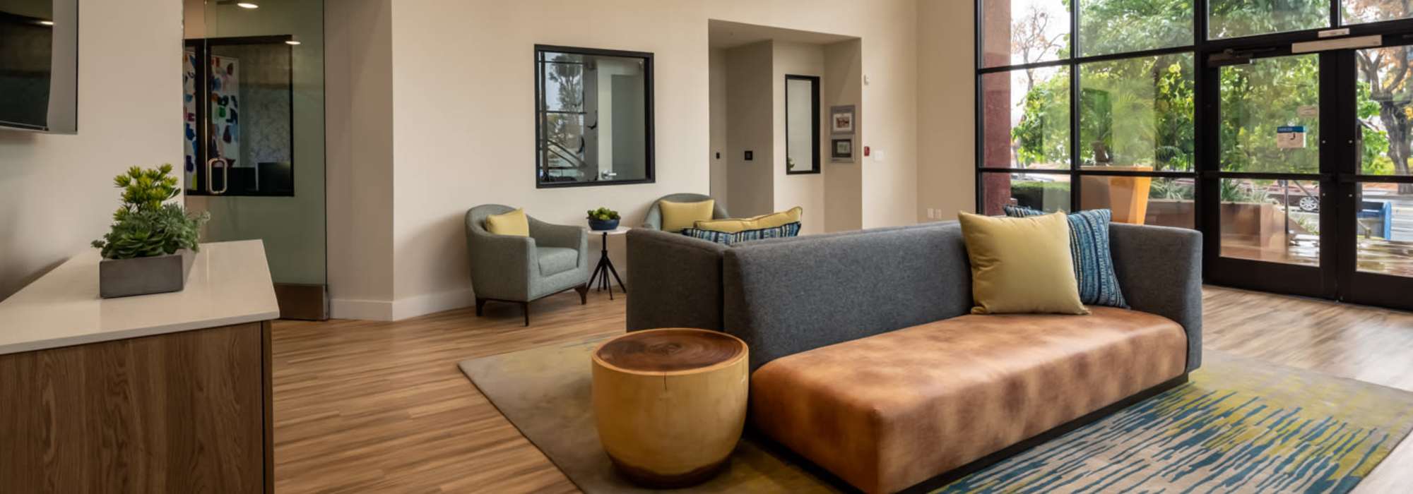 Comfortable community seating area in the clubhouse at The Pointe at Warner Center in Woodland Hills, California