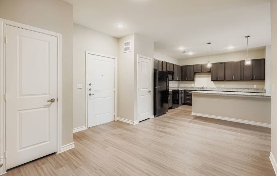 Modern kitchen with sleek cabinets and open layout at Standard at Royal Lane in Dallas, Texas