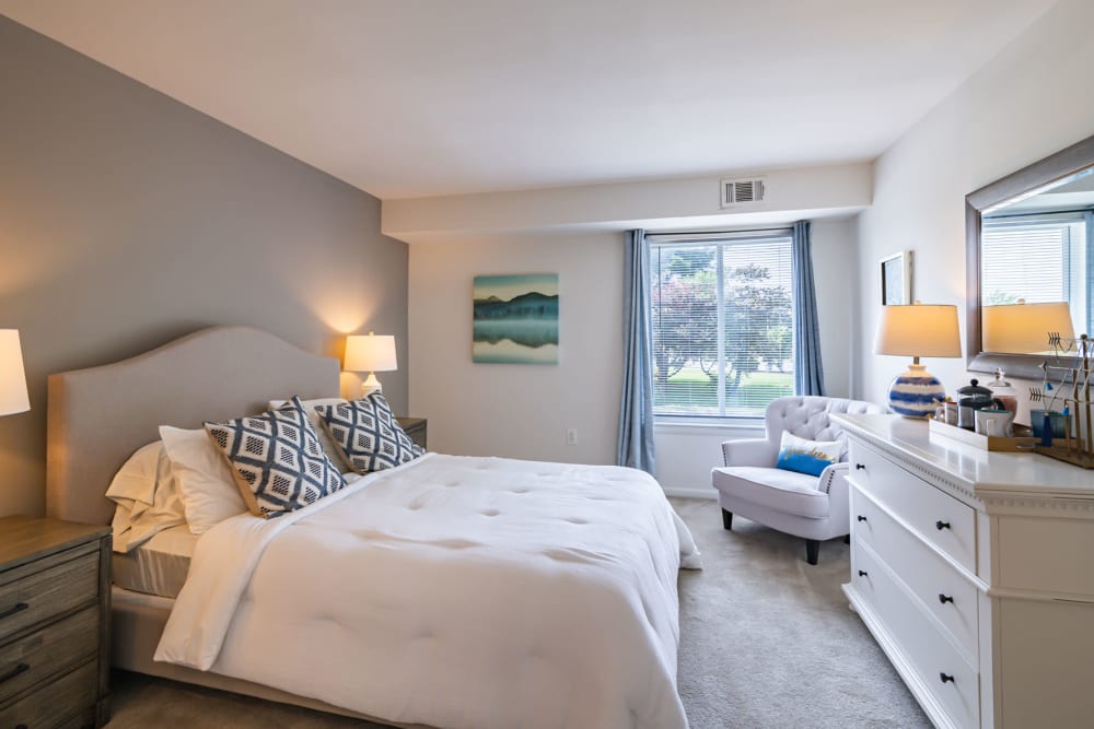 Model bedroom with plush carpeting at Country Village Apartment Homes in Dover, Delaware