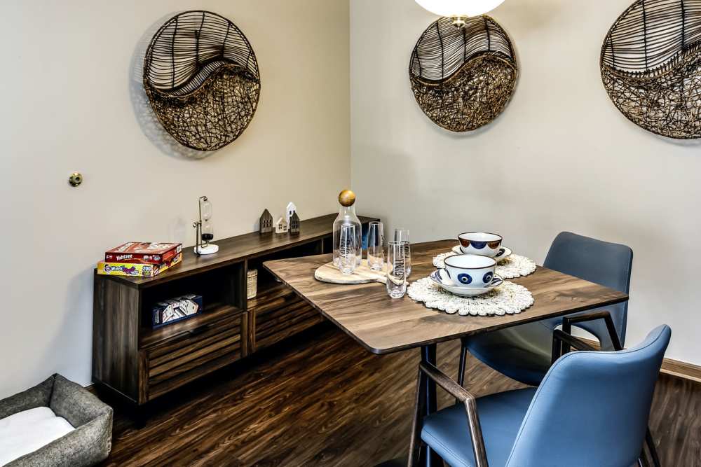 Dining area with wood-style flooring at The Falgrove Apartments in Omaha, Nebraska