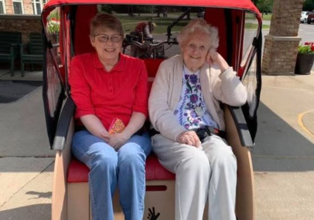 Two residents in trishaw at Bell Tower Residence Assisted Living in Merrill, Wisconsin