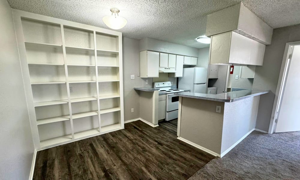 Dinning area with access to the kitchen at Santa Fe Apartments in Dallas, Texas