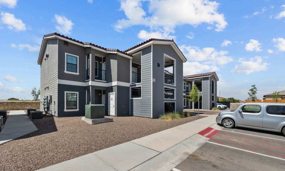 Building exterior view with parking at District At Pellicano in El Paso, Texas