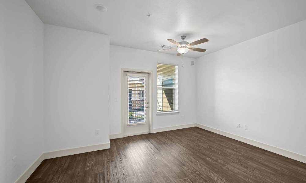 Living room with ceiling fan at Brook Hollow in Wichita Falls, Texas
