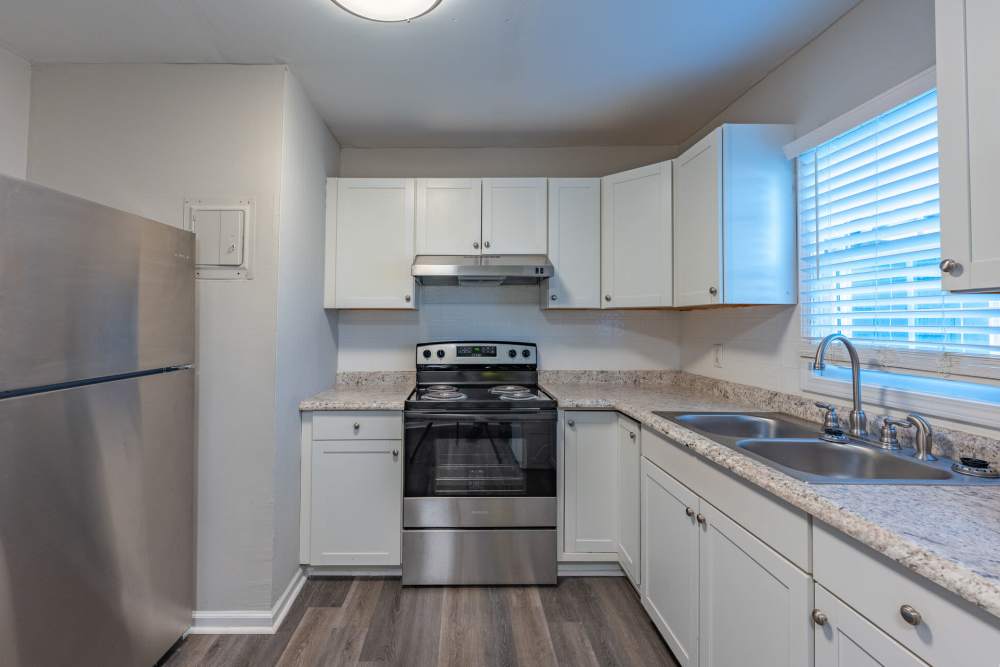 Kitchen with white color cabinet at Ivey Ridge Apartments in Graham, North Carolina