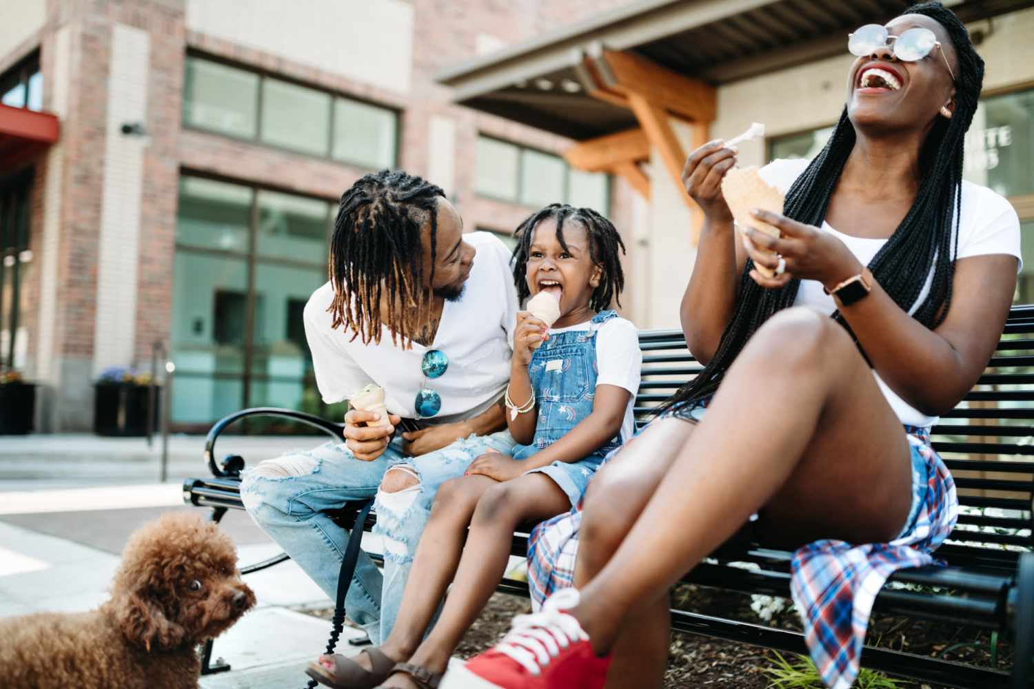 Residents family outside seating in bench near Wallace Terrace Apartments in Charlotte, North Carolina