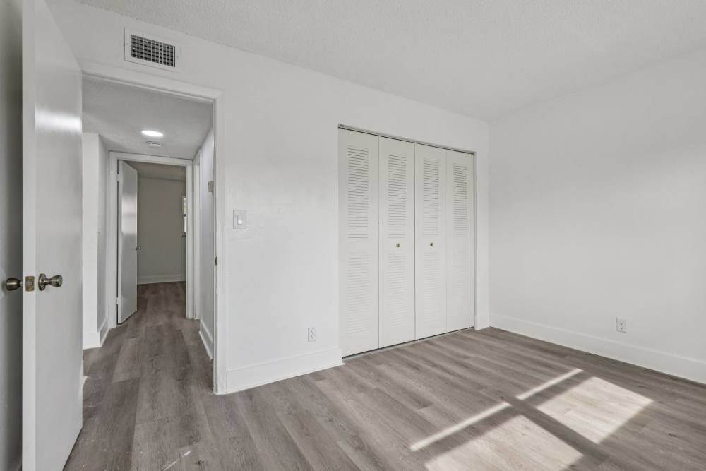 Apartment bedroom and hallway at El Jardin Apartments in Hollywood, Florida