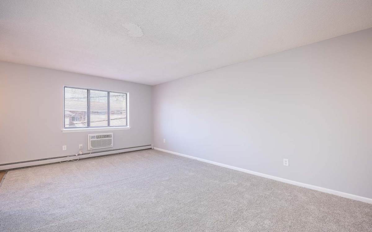 Spacious bedroom at Oakwood Manor Apartments in Fairport, New York