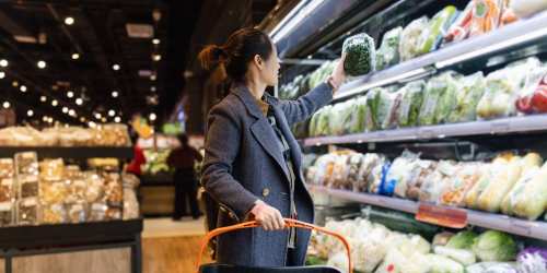 Resident shopping for produce at a grocery store near Eastwood on Grand in West Des Moines, Iowa