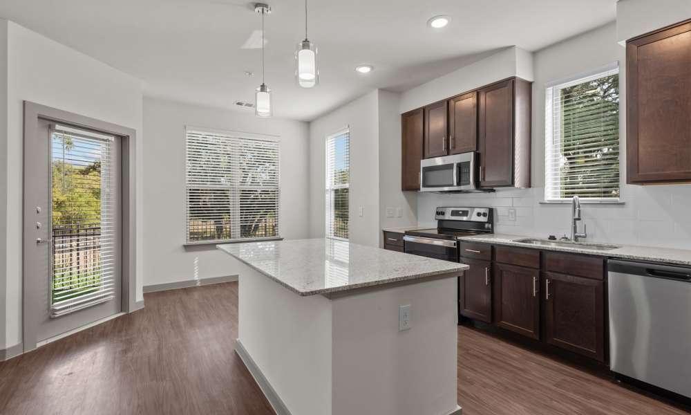 Kitchen with wooden cabinets at Opal Point at Kyle in Kyle,Texas