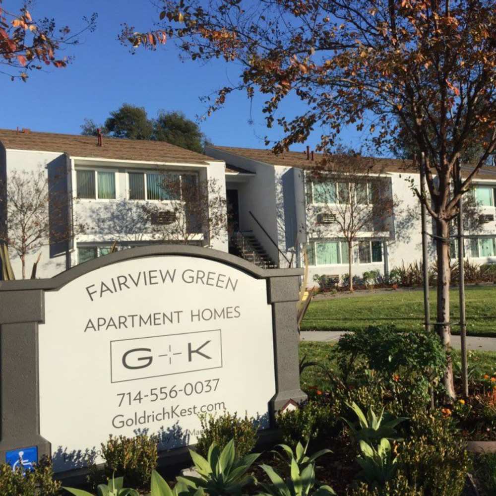 Exterior view of the community with property signage at Fairview Green in Santa Ana, California