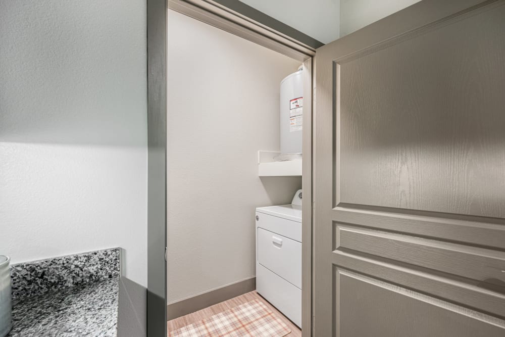 Washer and dryer in apartments at The Residences at Panther Hollow in Marble Falls, Texas