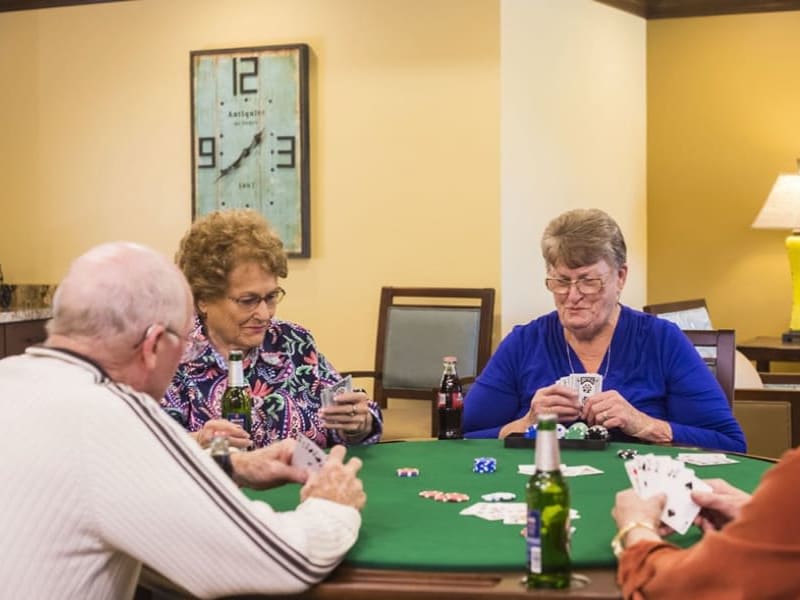 Residents playing card game at The Pointe at Summit Hills in Bakersfield, California. 