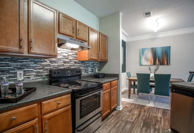 Kitchen with stainless steel appliances at Meadow Springs in College Park, Georgia