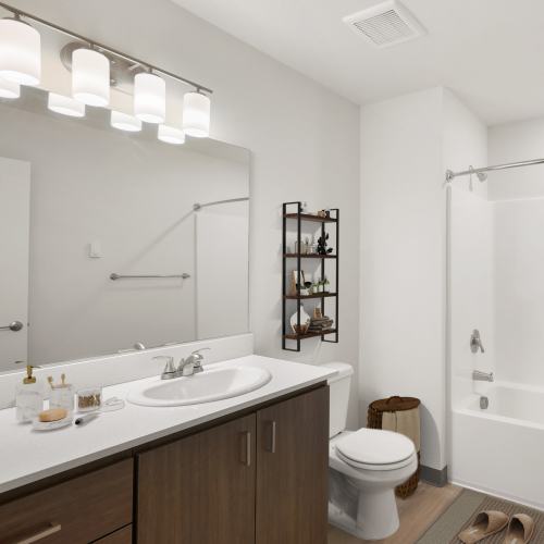 Bathroom with oversized vanity, custom cabinetry, and tub/shower combination at Cherry City Crossing in Keizer, Oregon