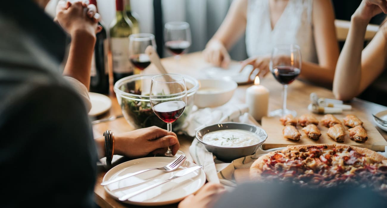 Resident enjoying dinner and wine near Highgate in Ewing, New Jersey