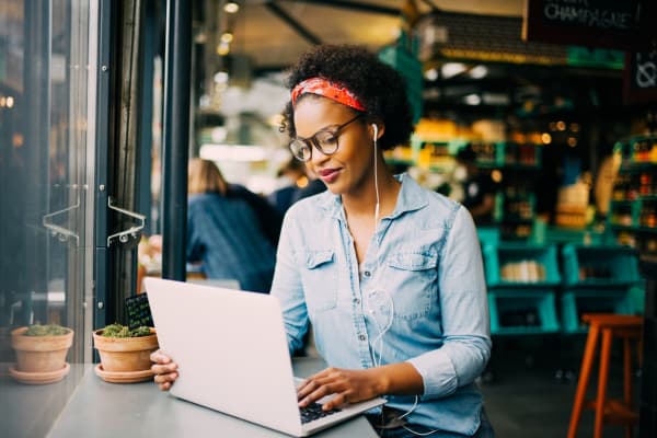 Resident working from a café shop near Pinnacle Apartments in Fife, Washington