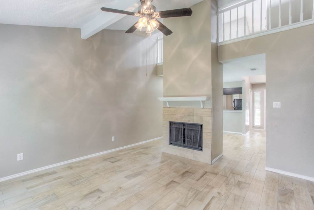 Unfurnished living with fire place at The Quorum At Trophy Club in Trophy Club, Texas