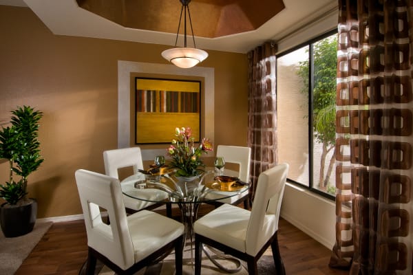 Modern decor in dining and breakfast bar area of model home at San Palmilla in Tempe, Arizona