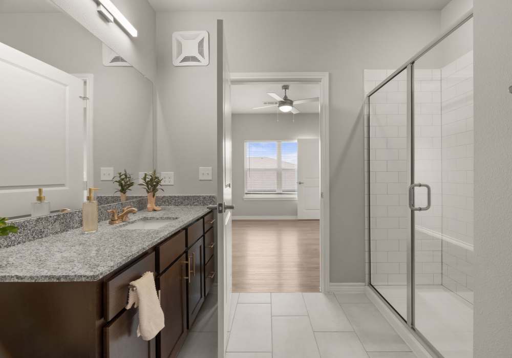 Bathroom featuring walk-in shower at Walnut Springs in Seguin, Texas