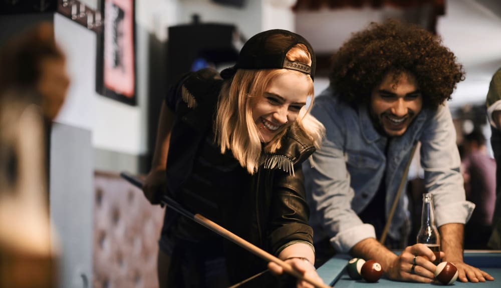 Residents playing pool together at 21 Rio in Austin, Texas