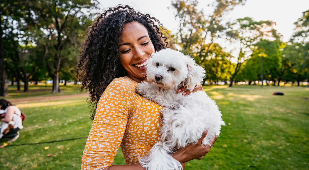 Woman with her dog at Crossbrook Apartments in Rohnert Park, California