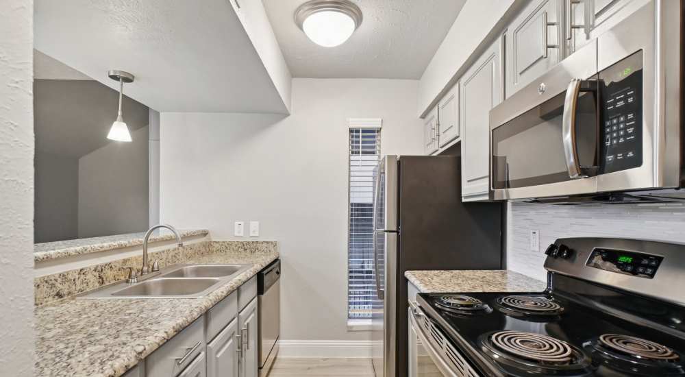 Kitchen with oven at Avondale Parc at Bellmar in Dallas, Texas  