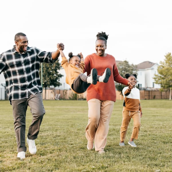 A family enjoys a walk near Attain at Towne Place, Chesapeake, Virginia