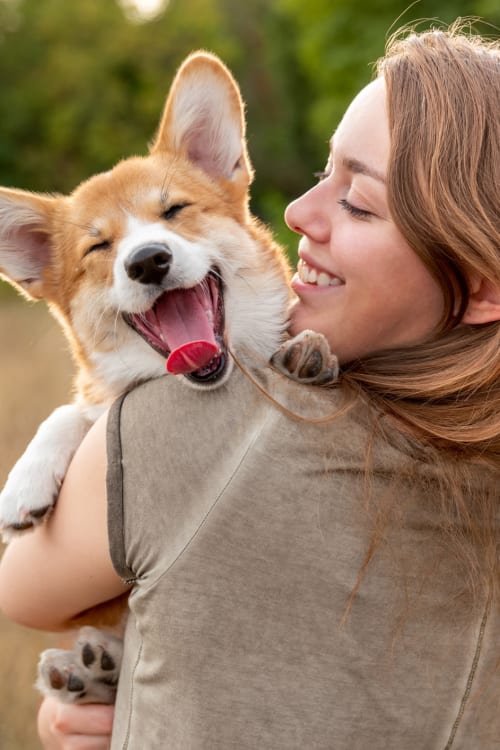 Resident cuddling with her pet at Parallel 36 at Liberty in Athens, Alabama