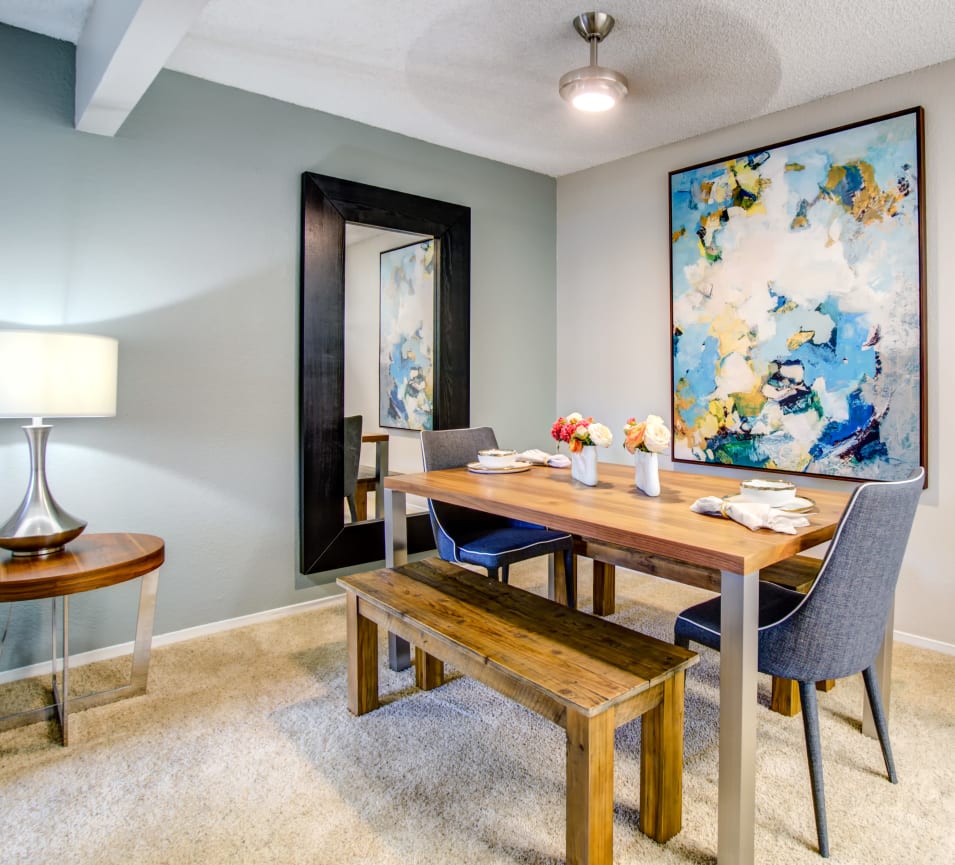 Well-decorated dining area with a ceiling fan in a model home at Vue Fremont in Fremont, California