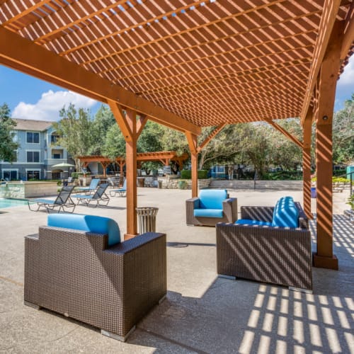 Chairs by the pool at Sycamore Springs in Austin, Texas